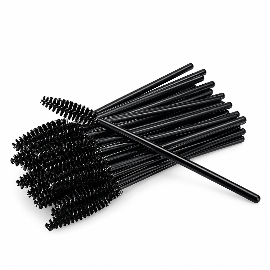 Black disposable mascara wands for professional lash and brow treatments arranged on a plain white background.