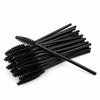 Black disposable mascara wands for professional lash and brow treatments arranged on a plain white background.
