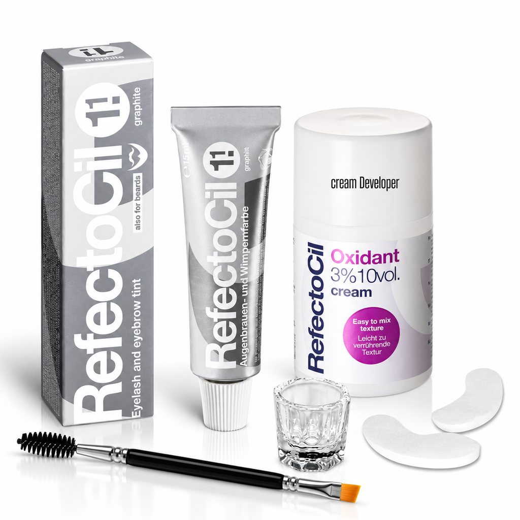 RefectoCil No. 1.1 Graphite brow tint kit with Oxidant 3% cream developer, under-eye pads, clear mixing glass and dual-ended tint brush on a white background